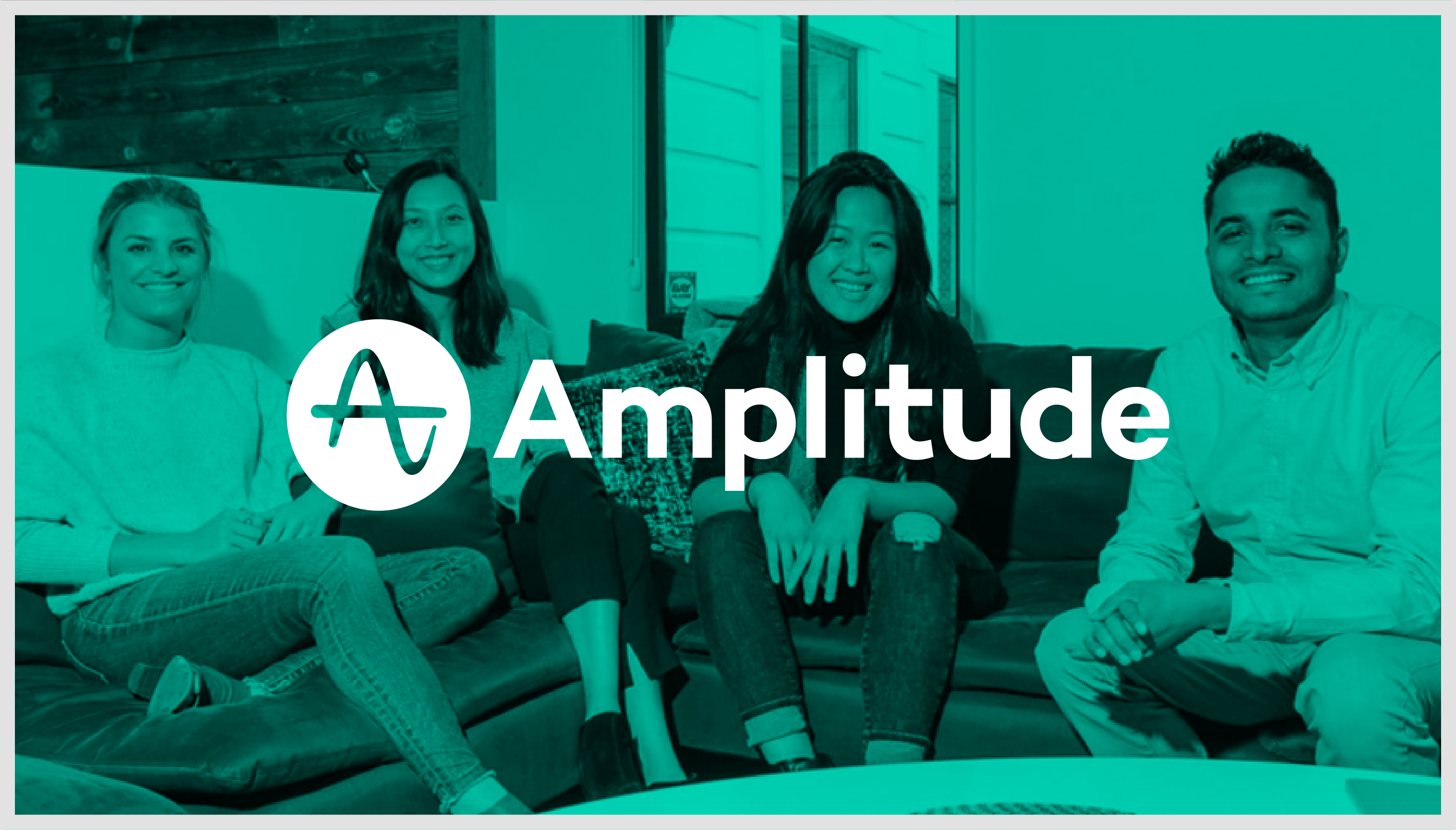 Amplitude logo over a photograph of a diverse group of employees
