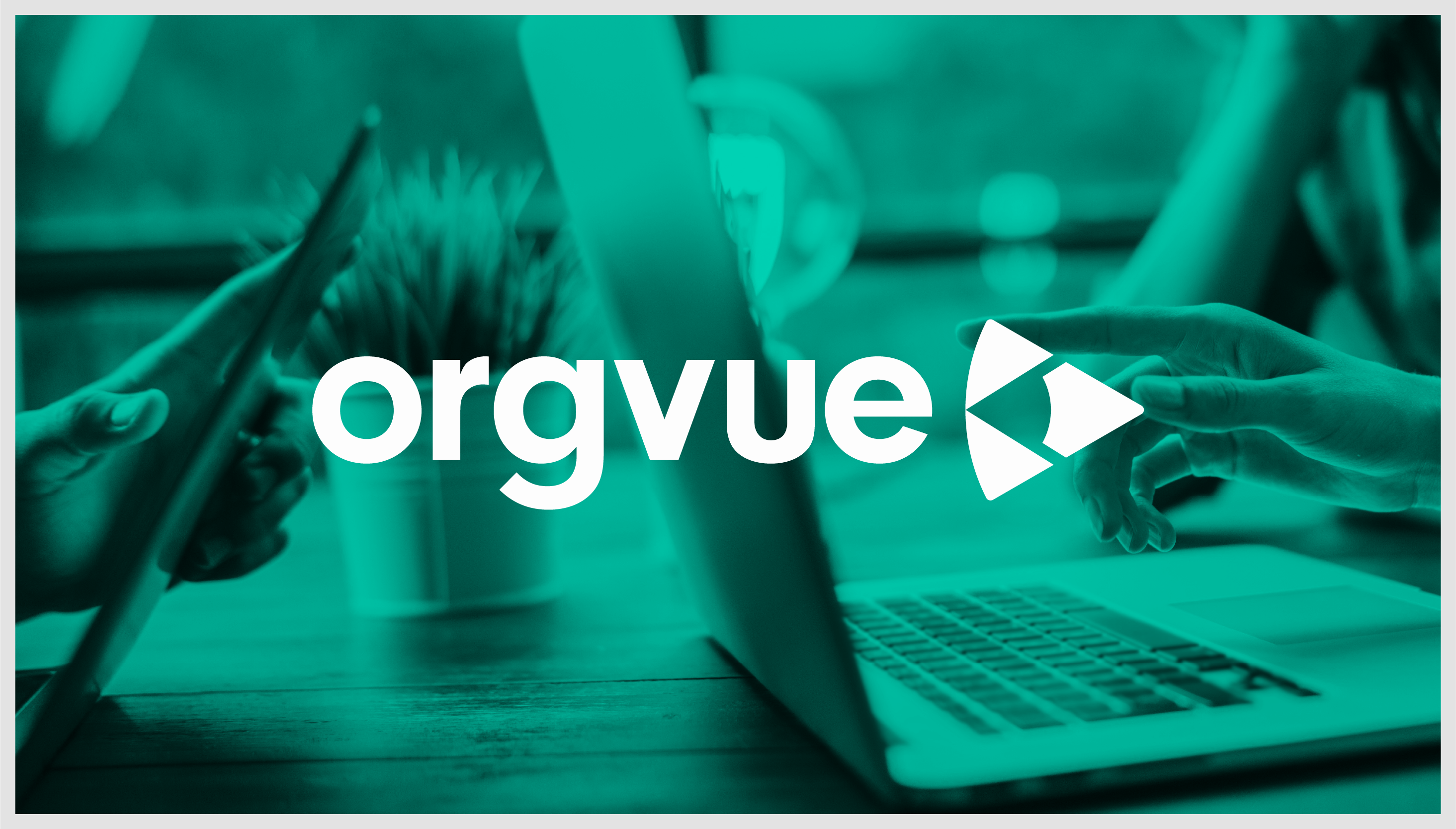 Orgvue logo over a photograph of two revenue leaders looking at reports on a laptop and tablet
