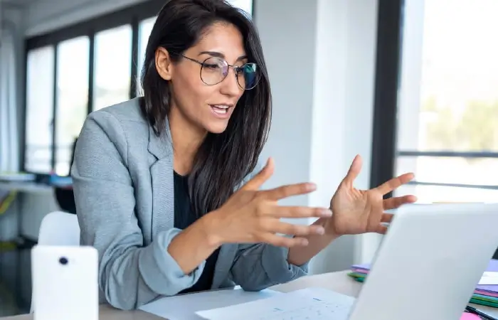 Photograph of a sales rep making a pitch on a video call